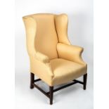 A GEORGE III MAHOGANY FRAMED WING BACK UPHOLSTERED ARMCHAIR 68cm wide x 62cm deep x 110cm high at