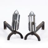 A PAIR OF CONTEMPORARY STEEL FIRE DOGS of art deco form, 17cm wide x 47cm deep x 30cm high (2)