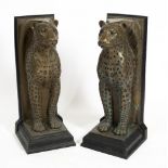 A PAIR OF LEOPARD PEDESTALS, bronze effect resin, after original bronzes by Willie Botha, each