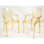 A PAIR OF GHOST CHAIRS by Philip Stark, in yellow perspex, 53cm wide x 50cm deep x 93cm high at