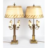 A PAIR OF CONTINENTAL BRASS TABLE LAMPS each with four scrolling branches, reeded support and square