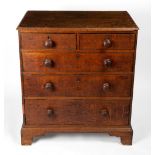 AN 18TH CENTURY CHEST OF TWO SHORT AND THREE LONG DRAWERS with later turned handles and raised on