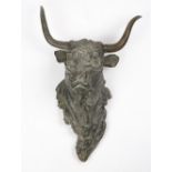 A FRENCH BRONZE SCULPTURE of the head of a bull, 36cm wide at the horns x 51cm high overall