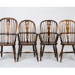 A GROUP OF FOUR SIMILAR ASH AND ELM WINDSOR ARMCHAIRS with pierced splats, carved seats and turned