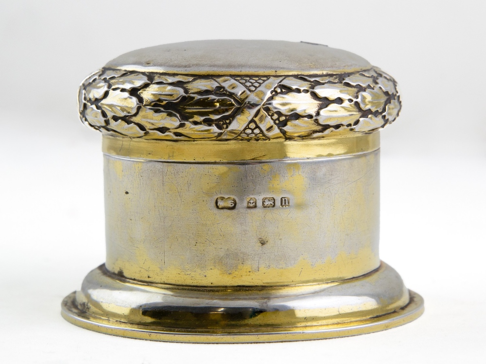 A GEORGE V SILVER GILT DRESSING TABLE BOX by the Duchess of Sutherland's Cripples Guild, the lid