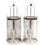 A PAIR OF SILVERED CYLINDRICAL LANTERNS with four branch lamp holders suspended within, 33cm