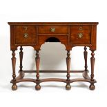A GEORGE III AND LATER OAK SIDE TABLE with three drawers around a central recess, the turned