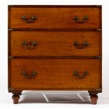 A MAHOGANY CAMPAIGN STYLE CHEST OF THREE DRAWERS with brass handles and turned feet, 85cm wide x