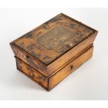 A REGENCY FAUX TORTOISE SHELL DECORATED SMALL WORKBOX with tapering sides, the lifting lid set