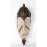 AN OLD PAINTED CARVED WOODEN TRIBAL MASK 24cm wide x 59cm high Condition: some marks due to use