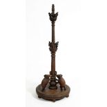 A LATE 19TH / EARLY 20TH CENTURY EASTERN CARVED HARDWOOD STANDARD LAMP decorated with angels and