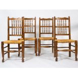 FOUR ASH SPINDLE BACK KITCHEN CHAIRS with rush seats, each 49.5cm wide x 102cm high