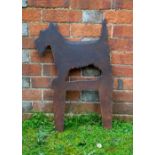 A BLACK PAINTED IRON BOOT SCRAPER in the form of a scottie dog, 45cm wide x 65.5cm high overall