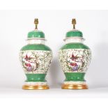 A PAIR OF OLD PORCELAIN VASES AND COVERS converted for use as table lamps, each decorated with