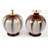 TWO PORCELAIN TABLE LAMPS of squat vase form, with a red, blue and cream striated glaze,