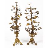 A PAIR OF GILDED TOLEWARE CANDELABRA of wheatsheaf and vine leaf form on a tripod base, each 95cm in