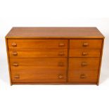 A 1960'S OR 70'S TEAK CHEST OF FOUR SHORT AND FOUR LONG DRAWERS 117cm wide x 46cm deep x 69cm high
