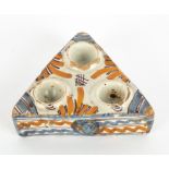 AN ANTIQUE TIN GLAZED TRIANGULAR SALT OR CRUET STAND 13.5cm x 15cm x 5cm high Condition: chips to