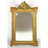TWO SIMILAR OLD GILT RECTANGULAR WALL MIRRORS with outset corners and gesso moulded ornamental