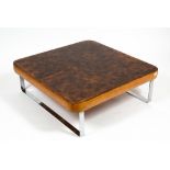 A LATE 20TH CENTURY SQUARE OAK AND HARDWOOD TOPPED COFFEE TABLE with chrome supports, 88cm wide x