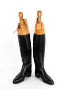 A PAIR OF LADIES BLACK LEATHER RIDING BOOTS the base of each boot 26.7cm in length x 43.5cm in