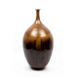 A LATE 20TH / EARLY 21ST CENTURY LARGE POTTERY BOTTLE VASE with a mottled gold and deep red glaze,