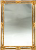 A MODERN RECTANGULAR GILT FRAMED WALL MIRROR with mirrored slips around the bevelled glass, 95cm