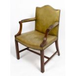 A GEORGIAN STYLE MAHOGANY AND GREEN LEATHER UPHOLSTERED OPEN ARMCHAIR 65cm wide x 58cm deep x 92cm