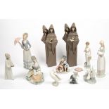 A COLLECTION OF LLADRO AND NAO PORCELAIN FIGURINES to include two Lladro monk figurines, each