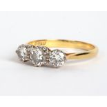 AN 18 CARAT GOLD THREE STONE DIAMOND RING by F E U, 2.9 grams in total At present, there is no