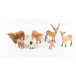A GROUP OF SEVEN BESWICK PORCELAIN ANIMALS to include two Highland cows Condition: sheep with some