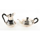 A MATCHING SHEFFIELD SILVER TEAPOT AND HOT WATER JUG each with carved ebony handles and marks for