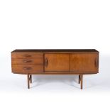 A 1960'S OR 70'S TEAK SIDEBOARD with twin sliding doors and three drawers, 163cm wide x 43.5cm