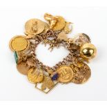 A 9 CARAT GOLD CHARM BRACELET with a 9 carat gold heart shaped locket and twenty three gold and