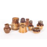 A ROYAL DOULTON STONEWARE SILVER TOPPED CRUET SET to include a pepperette 7.5cm in height, a salt