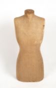 AN EARLY 20TH CENTURY TORSO MANNEQUIN 34cm wide x 82cm high Condition: some tears and holes to the