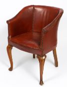 AN EARLY 20TH CENTURY STUDDED RED LEATHER UPHOLSTERED TUB CHAIR with cabriole legs, 60cm wide x 55cm