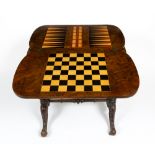 A VICTORIAN WALNUT GAMES TABLE with a folding top and a single drawer, 68cm wide x 41cm deep x