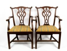 A PAIR OF CHIPPENDALE STYLE MAHOGANY OPEN ARMCHAIRS with upholstered inset seats, 64cm wide x 49cm