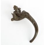 A LATE 19TH / EARLY 20TH CENTURY BRONZE DOOR HANDLE in the form of a cherub and a serpent, marked