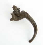 A LATE 19TH / EARLY 20TH CENTURY BRONZE DOOR HANDLE in the form of a cherub and a serpent, marked