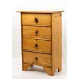 A SMALL PINE CHEST OF FOUR DRAWERS with brass handles and bracket feet, 42cm wide x 23cm deep x 62cm