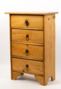 A SMALL PINE CHEST OF FOUR DRAWERS with brass handles and bracket feet, 42cm wide x 23cm deep x 62cm