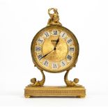 A LUXOR JARRARD FRENCH GILT METAL MANTLE CLOCK of circular form surmounted by a classical
