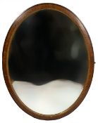 AN EARLY 20TH CENTURY MAHOGANY AND GILDED OVAL WALL MIRROR 84cm wide x 110cm high Condition: surface