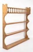 A VICTORIAN PINE FOUR TIER WALL SHELF 85cm wide x 13cm deep x 86cm high At present, there is no