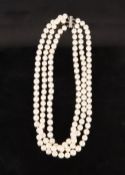 A TRIPLE STRING OF MODERN PEARLS each pearl 7cm diameter, overall weight 147 grams, having a