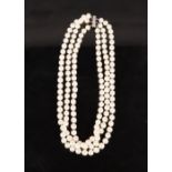 A TRIPLE STRING OF MODERN PEARLS each pearl 7cm diameter, overall weight 147 grams, having a