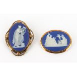 TWO 19TH CENTURY WEDGWOOD JASPERWARE BROOCHES with yellow metal mounts, one marked 9 carat, the