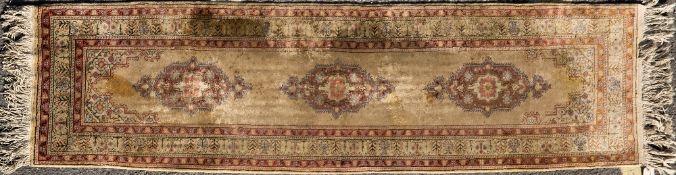 A KAYSERI YOLWK MIDDLE EASTERN RED AND YELLOW GROUND RUNNER 59cm x 230cm Condition: some minor